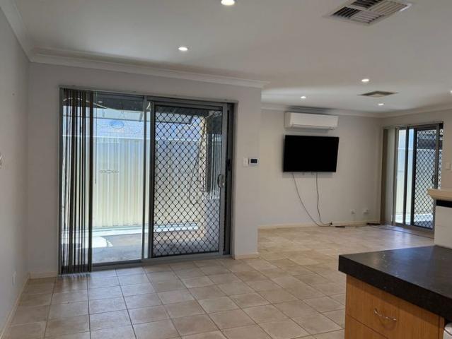 Charming, Secure 4 Bedroom, 2 Bathroom Home, Featuring Triple Garage with Extra Parking & Entertainer's Patio