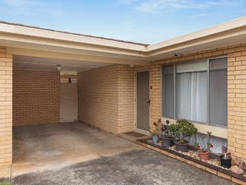 Charming Solid Brick Homette in Boutique Group of Three