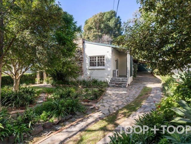 CHARMING STONE COTTAGE SET AMONGST ESTABLISHED GARDENS