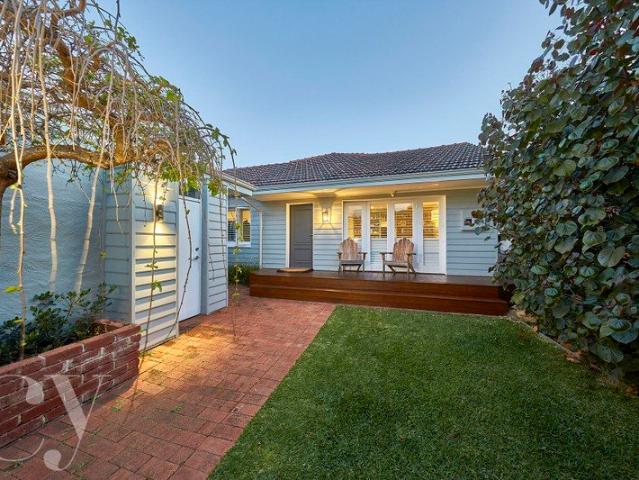 Comfort & Character in a Coveted Riverside Address