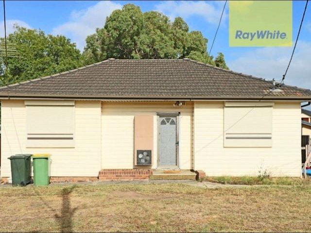 Comfortable Three Bedroom Home with Spacious Backyard
