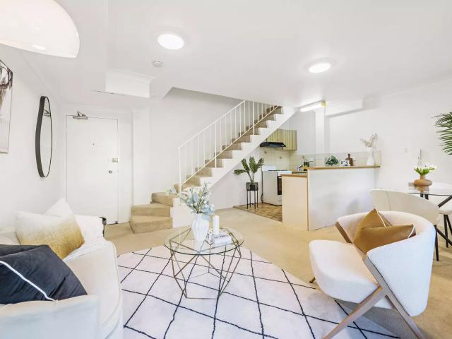 Comfortable Top Floor Split Level with Secure Parking in Prime Inner City Location