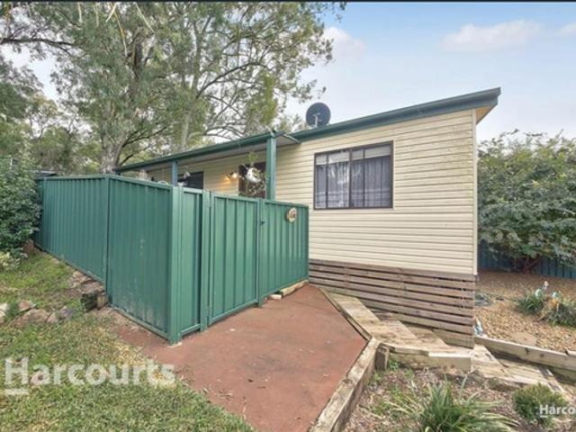 Comfortable Two Bedroom Home with Large Shed.