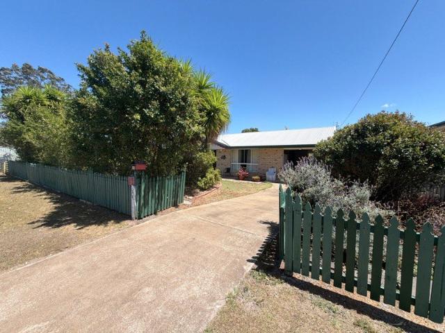 Comfortable Brick Home with Established Gardens