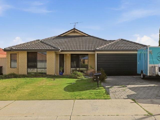 COMFORTABLE FAMILY LIVING WITH LOW MAINTENANCE GARDENS AND A CONVENIENTLY CENTRAL SETTING