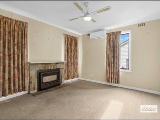 Comfortable Home with Flexible Living Space & Large Backyard