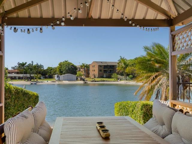 Completely Renovated Waterside Duplex Offering Luxury, Privacy & Direct Water Access