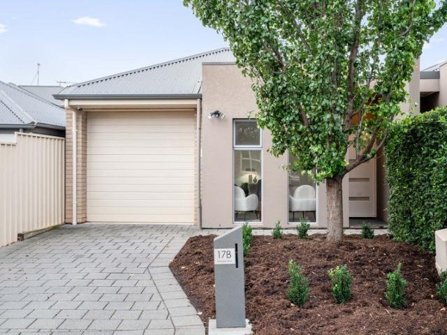 Stylish Courtyard Living with North Facing Rear Yard in a Prime Tree Lined Location