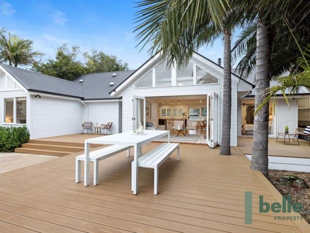 Contemporary coastal bliss steps from the sand!
