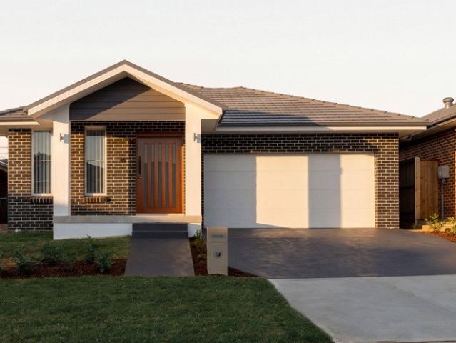 Contemporary Brick Home with Spacious Backyard in a Thriving Community