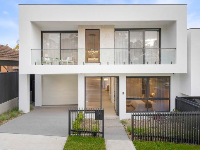 Contemporary Double Brick Family Duplex with Exceptional Space & Unmatched Convenience