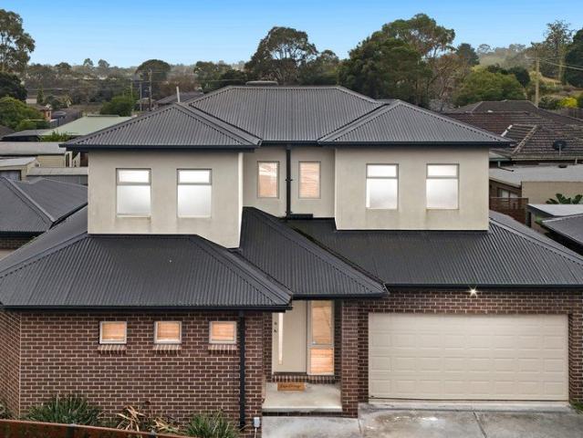 Contemporary Dual Level Living with Multiple Living Zones and a North Facing Backyard