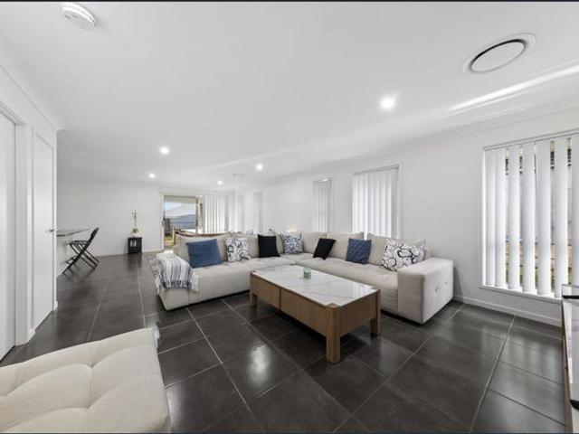 Contemporary Family Living with Space, Comfort and Rear Views