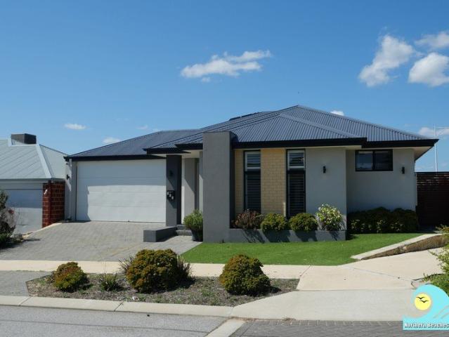 CONTEMPORARY FAMILY LIVING ON A LOW MAINTENANCE CORNER BLOCK