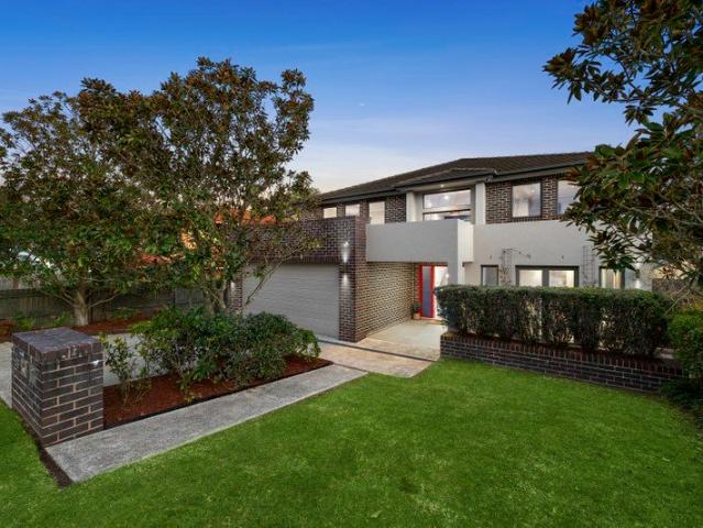 Contemporary family residence in leafy creekside setting