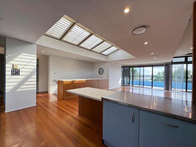 Contemporary Family Sanctuary with Leafy Water Views