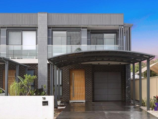 Contemporary full brick duplex delivers a superb combination of scale, style and practicality