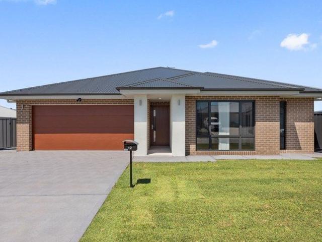 Contemporary home with lawn maintenance included