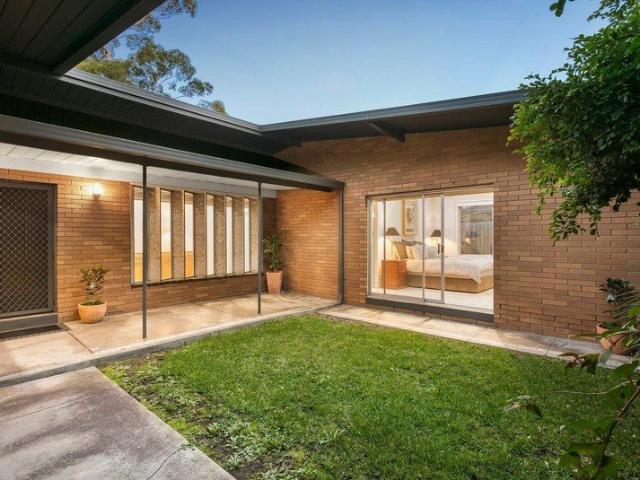 CONTEMPORARY HOME IN A CONVENIENT PARK SIDE POSITION
