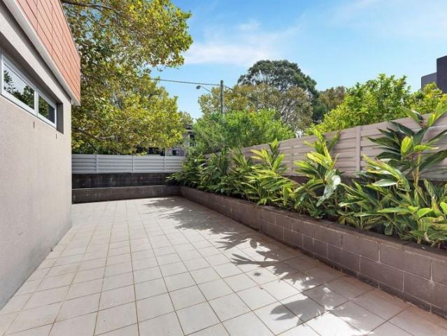 Contemporary one bedroom plus study courtyard apartment