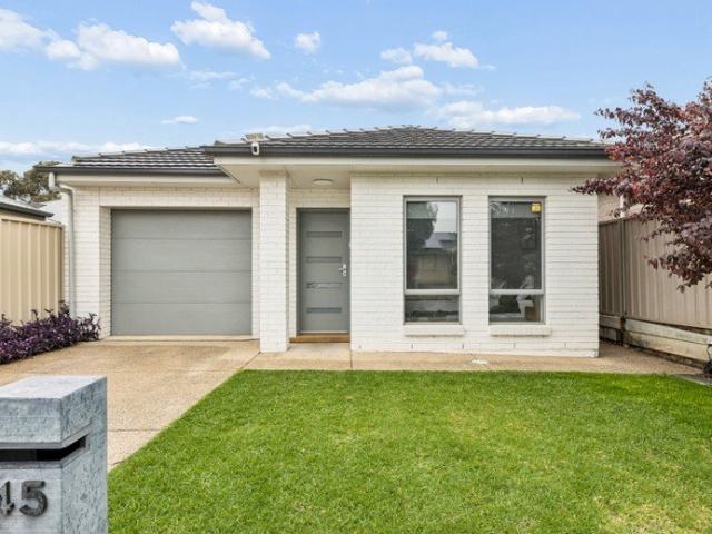 Contemporary low maintenance living with dual outdoor entertainment zones