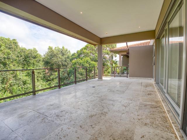 Contemporary, spacious condo offering serene views of a lush forest