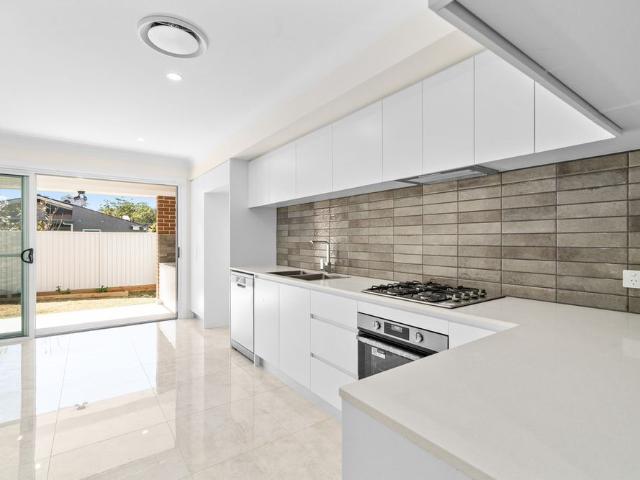 Contemporary Three Bedroom Townhouse with Main Road Convenience!