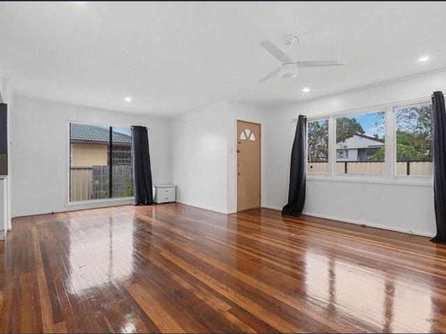 Convenient Family Living with Spacious Yard in Prime Logan Central Location