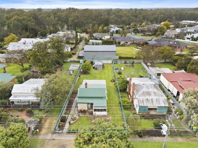 Convenient location with rear lane access
