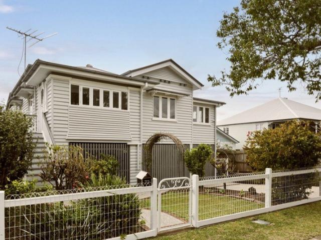 Convenient Queenslander with 4 car lockup accommodation + workshop