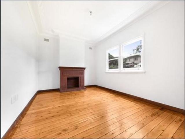 CONVENIENTLY LOCATED 2 BEDROOM PLUS SUNROOM HOME