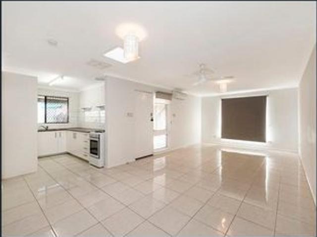Conveniently Located Duplex with Large Yard & Ample Parking