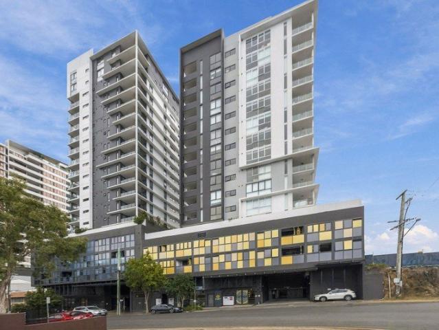 CONVINIENT LIVING WITH POOL, ROOFTOP TERRACE & CITY VIEWS.