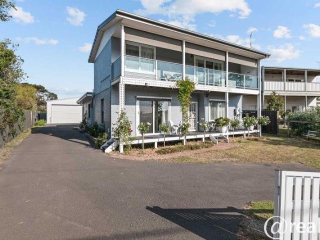 Coastal Charm, Water Views & Income Potential