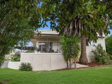 Coastal Comfort with Views, Versatility & a Sought After Location!