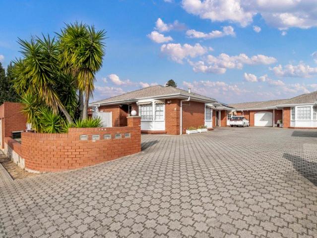 Coastal Convenience in a Private Group with Rare Double Garage