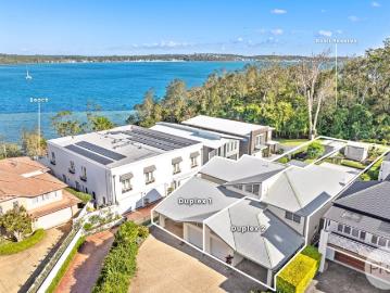 Coastal Duplex Living with Water Views Buy One or Secure Both