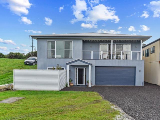 Coastal Elevation and Modern Living Steps from the Water