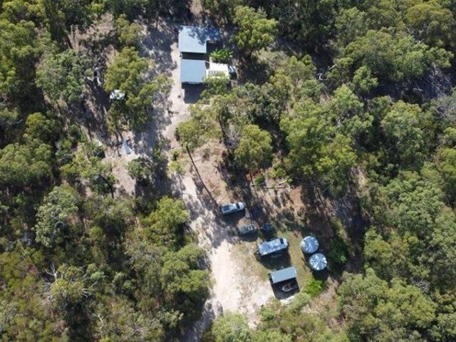 COASTAL ESCAPE WITH OFF GRID COMFORT ON 40 ACRES
