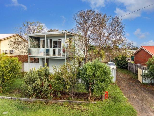 Coastal Escape with Bay Views and Future Potential
