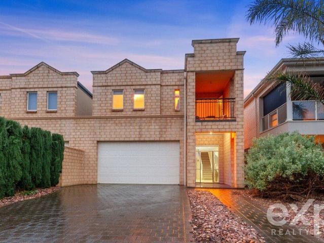 Coastal Living Just Steps from the Beach in Sought After Blue Chip location