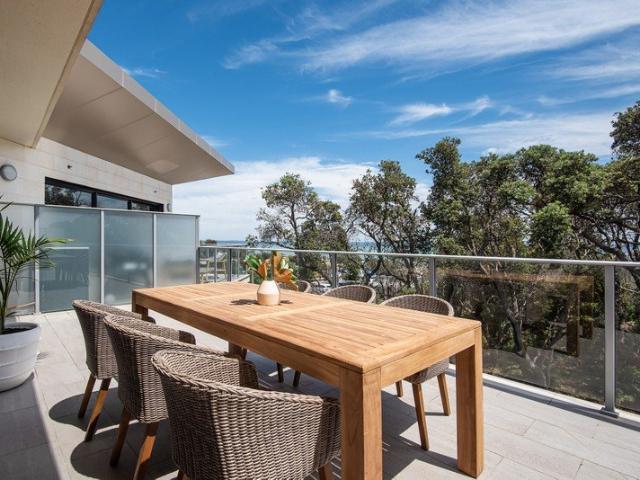 Coastal Living Just Steps from the Sand with Bay Views