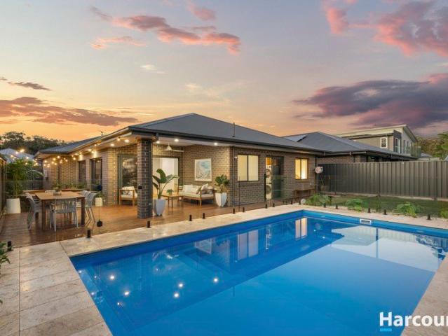 Coastal style, family space & a resort backyard made for entertaining
