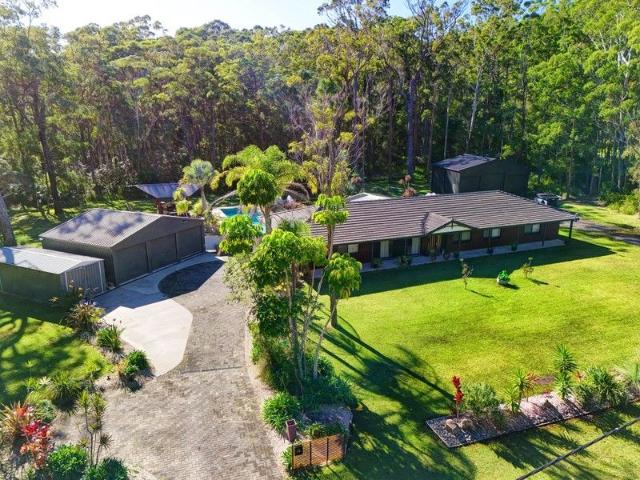 Coastal sanctuary on 1.24 acres ~ resort style living!
