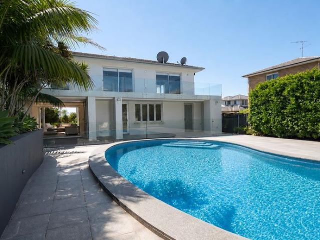 COASTAL TROPHY HOME WITH BREATHTAKING WATER VIEWS, POOL AND MULTIPLE LIVING ZONES