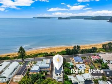 Coastal Views, Space & Privacy A Rare Two Level Beachside Apartment