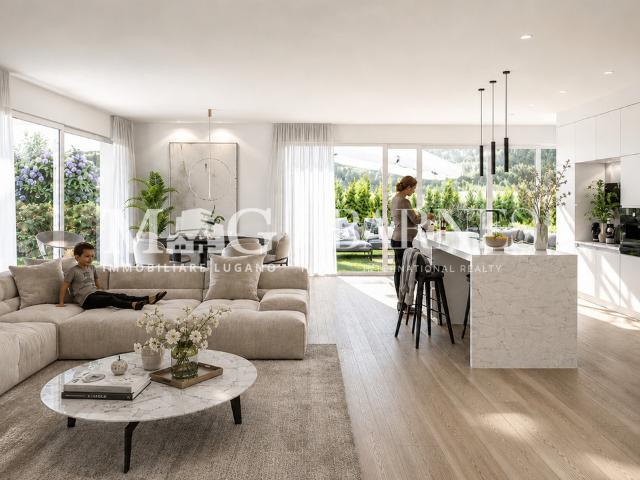 Collina d'Oro: Neue 4,5 Zimmer Wohnung mit privatem Garten