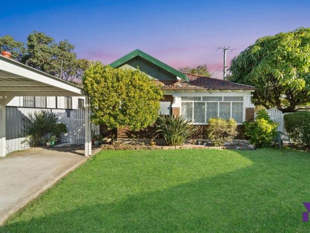 Corner position, comfortable family residence just 800m from Punchbowl Station