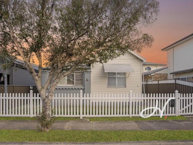 COSMETICALLY RENOVATED 5 BEDROOM HOME IN HEART OF MAYFIELD!