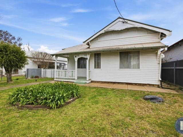 Cottage Charm with Space and Potential